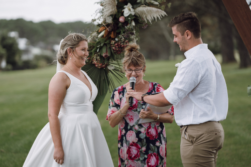 Bride, groom exchanging vows.